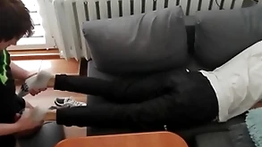 Young chap pays out his currency up his legs